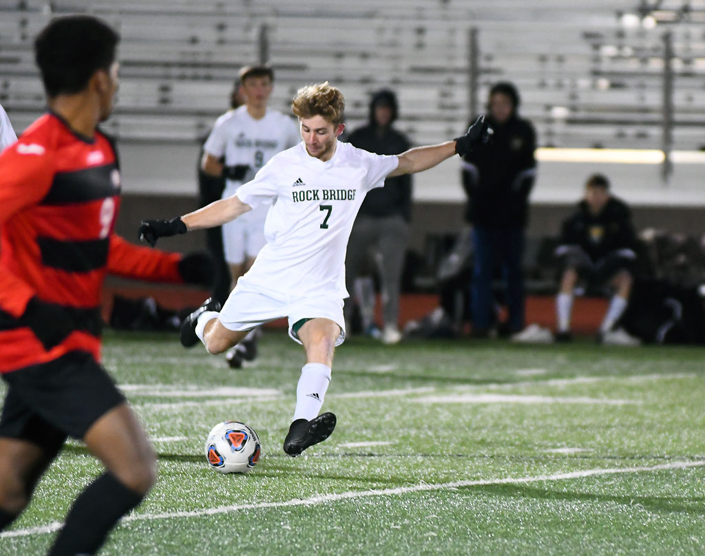 Midfielder Preston Fancher kicks the ball upfield in a game against the Jefferson City Jays Thursday